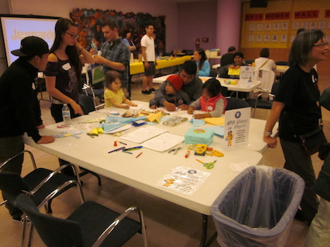Three children and adult at activity station