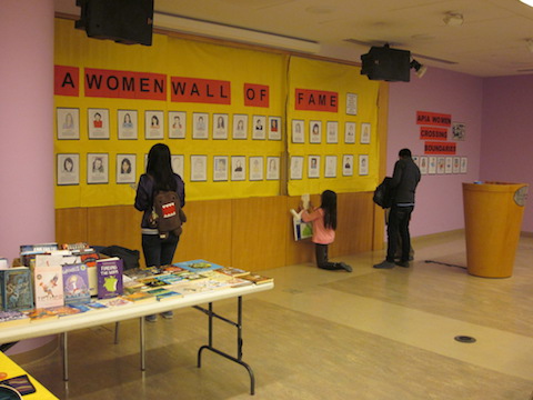 Two children and adult at Women Wall of Fame display